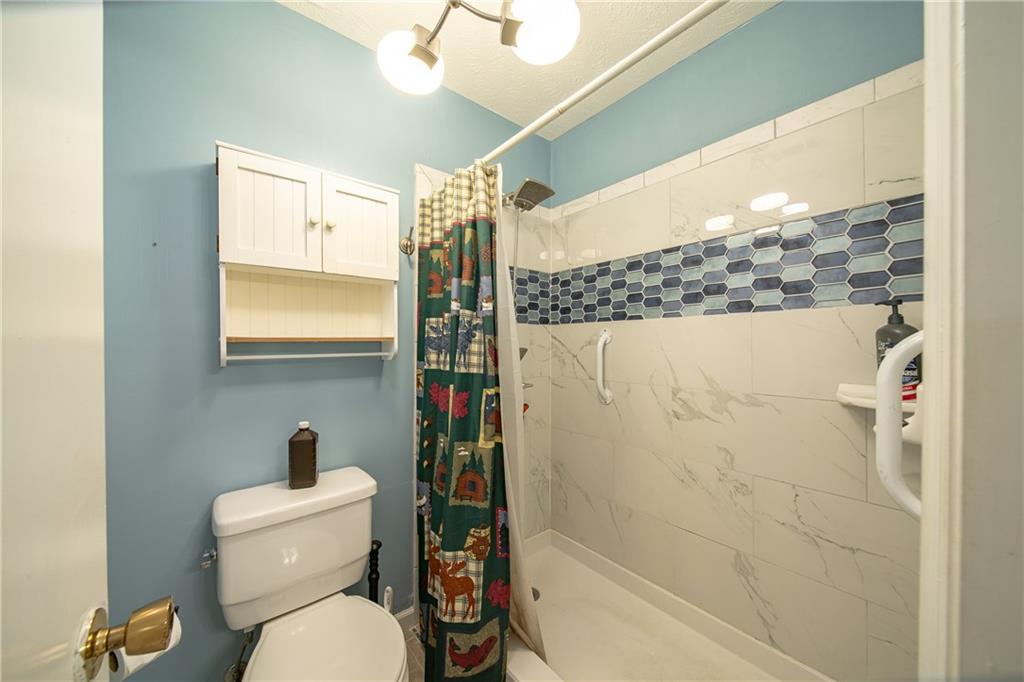 143 Lee Road 979 Phenix City, AL 36870 - Photo 34 of 37 Bathroom with a shower with shower curtain and toilet