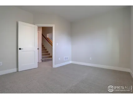 a view of an empty room and a window