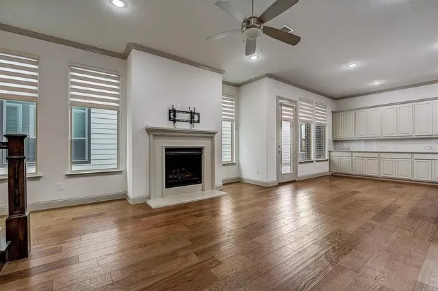 a view of a livingroom with a fireplace and window