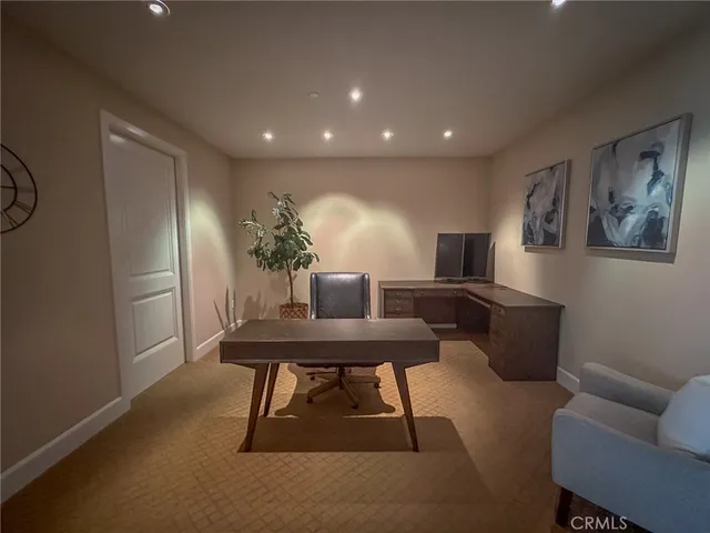 a view of a swimming pool with a garden and trees