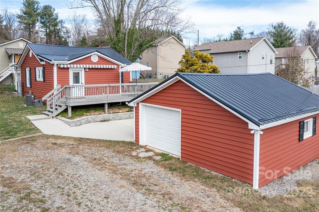 60 Shiloh Road Asheville, NC 28803 - Photo 1 of 13 a front view of a house with a yard and garage