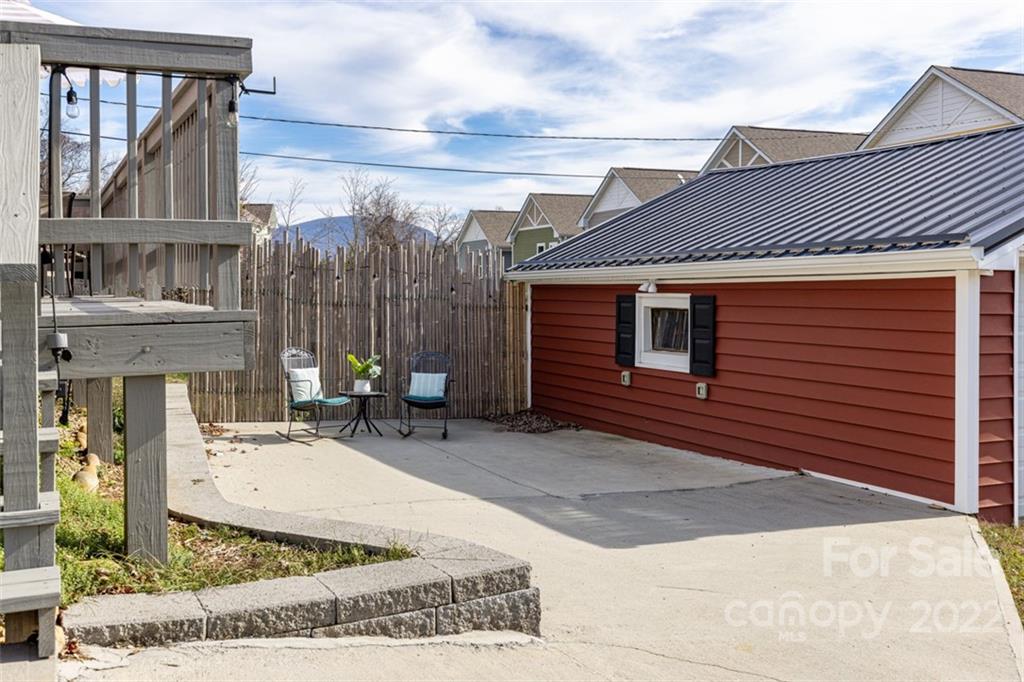 60 Shiloh Road Asheville, NC 28803 - Photo 12 of 13 a view of a house with sitting area and furniture