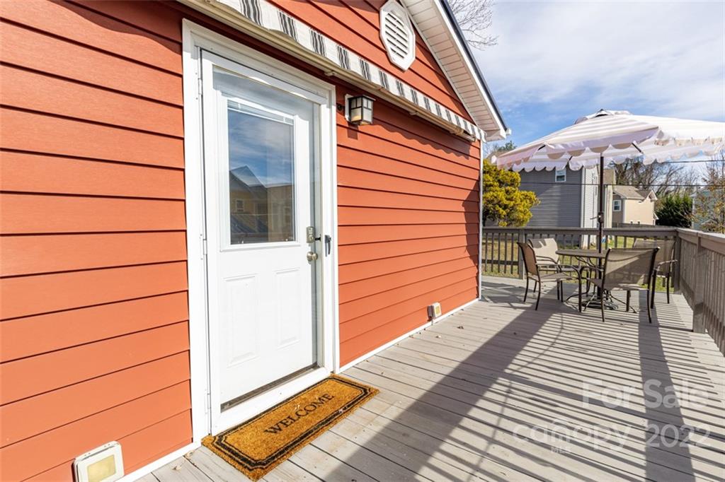 60 Shiloh Road Asheville, NC 28803 - Photo 2 of 13 a balcony with table and chairs