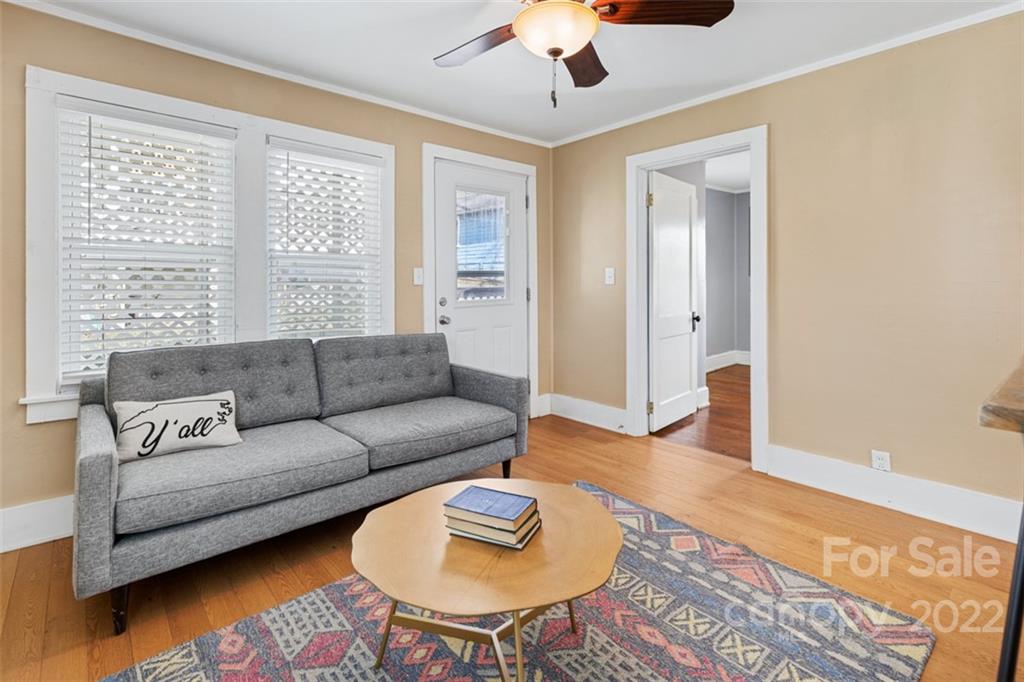 60 Shiloh Road Asheville, NC 28803 - Photo 3 of 13 a living room with furniture and a wooden floor