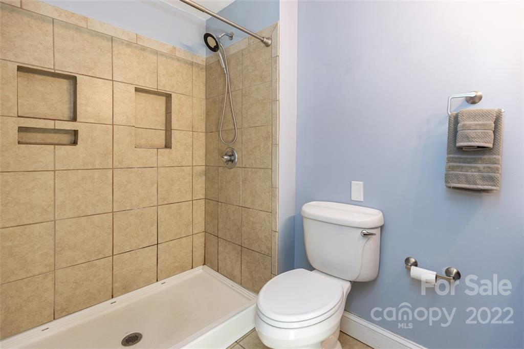 60 Shiloh Road Asheville, NC 28803 - Photo 9 of 13 a bathroom with a toilet and a shower