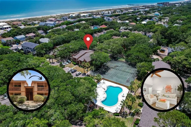 an aerial view of a house with a swimming pool and outdoor space