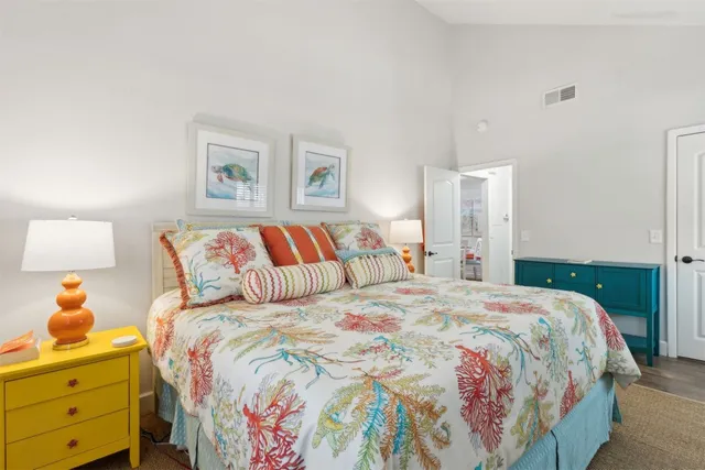 a bedroom with a bed and a lamp with window