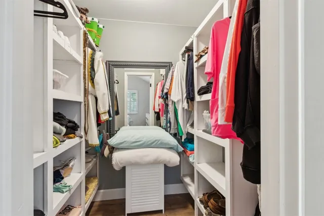 a living room with furniture and a bed