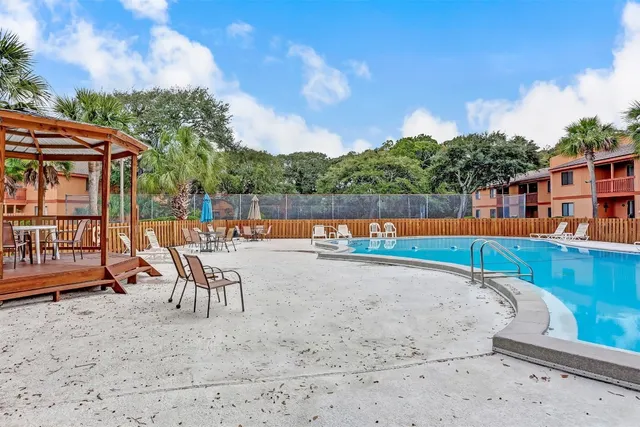 a view of swimming pool with a lounge chair