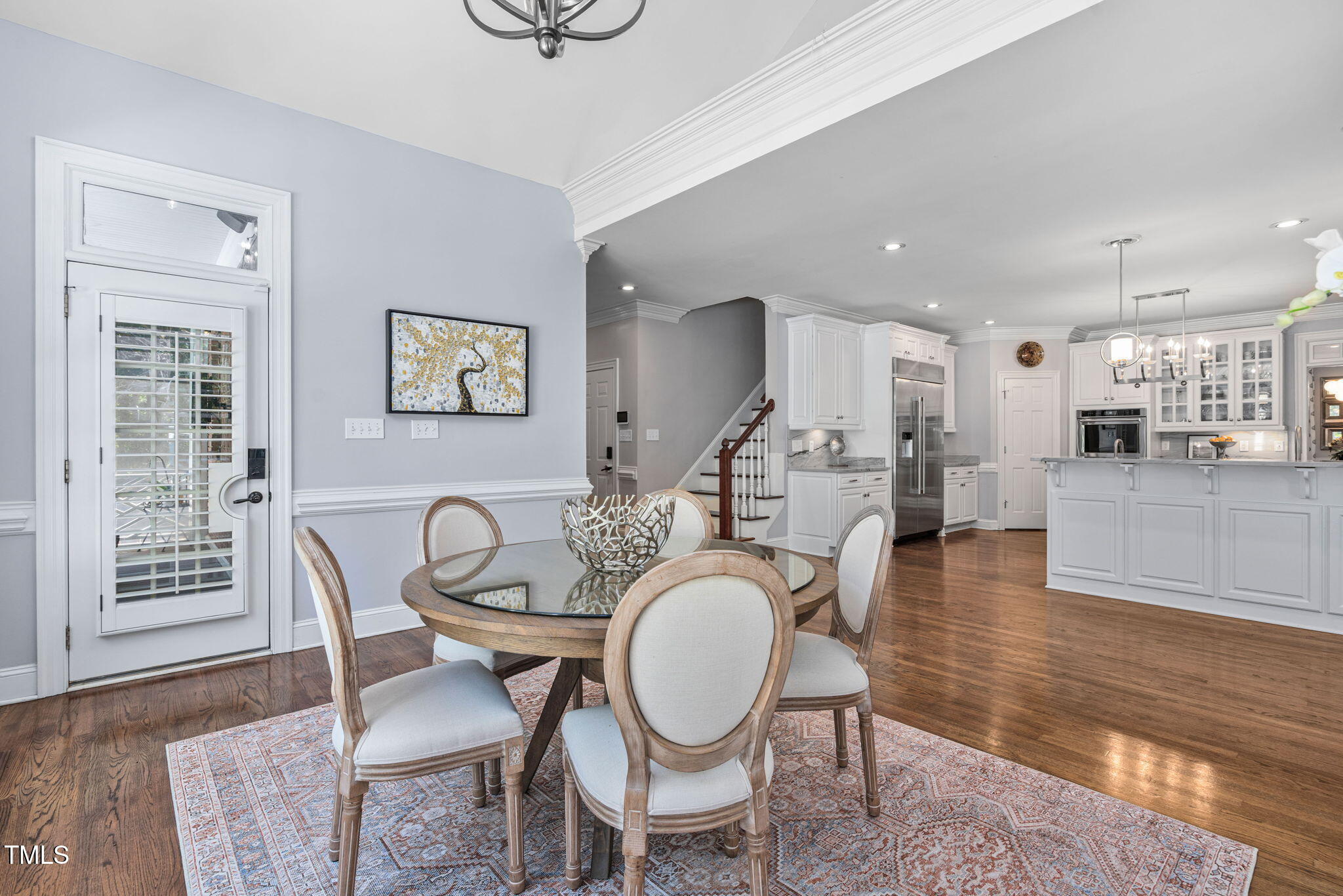 12012 Six Forks Road Raleigh, NC 27614 - Photo 27 of 100 a dining room with furniture a rug and wooden floor