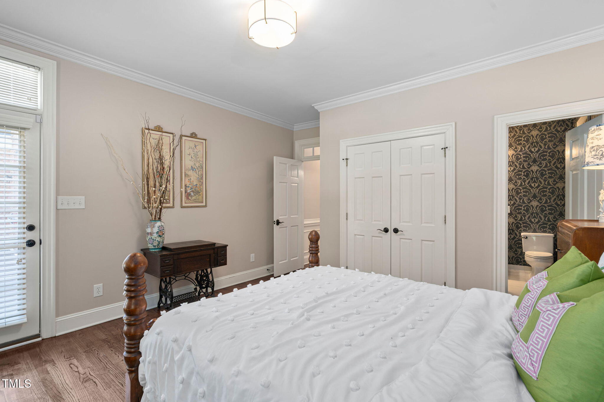 12012 Six Forks Road Raleigh, NC 27614 - Photo 30 of 100 a bedroom with a bed and a table in it