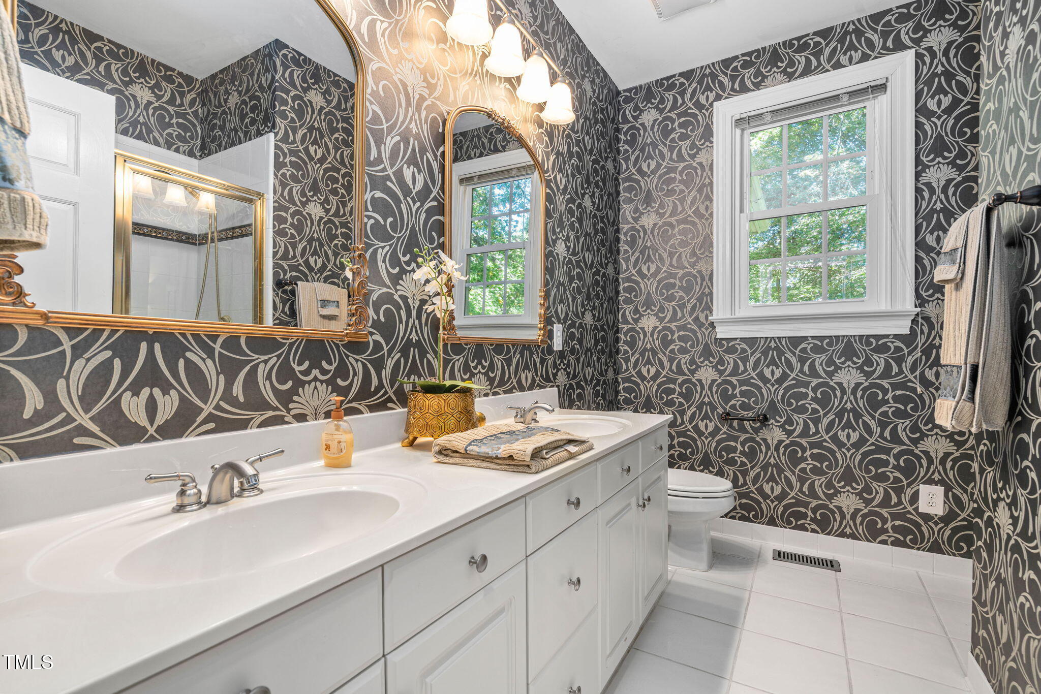 12012 Six Forks Road Raleigh, NC 27614 - Photo 31 of 100 a bathroom with a sink and a mirror