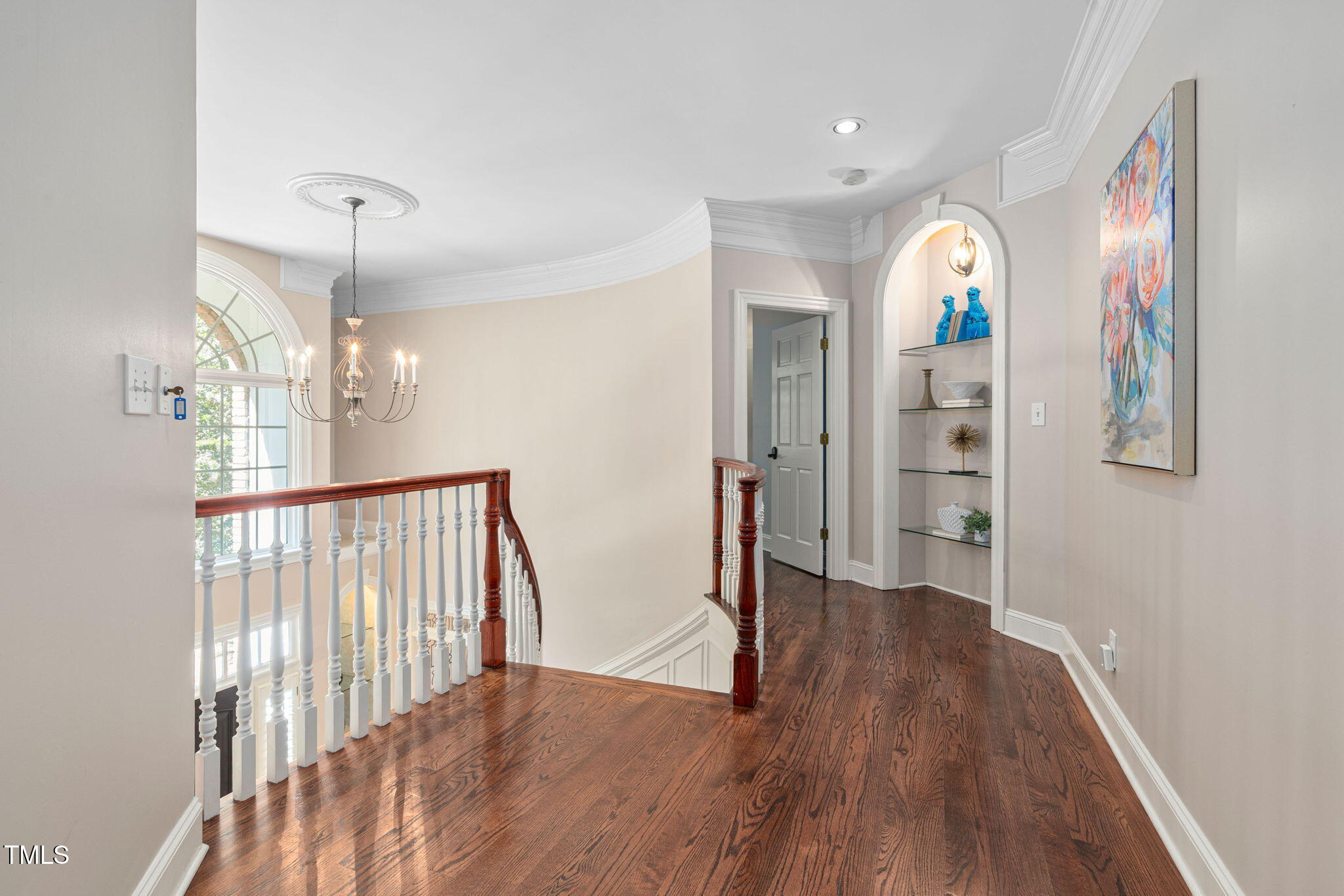 12012 Six Forks Road Raleigh, NC 27614 - Photo 34 of 100 a view of a hallway with wooden floor and staircase