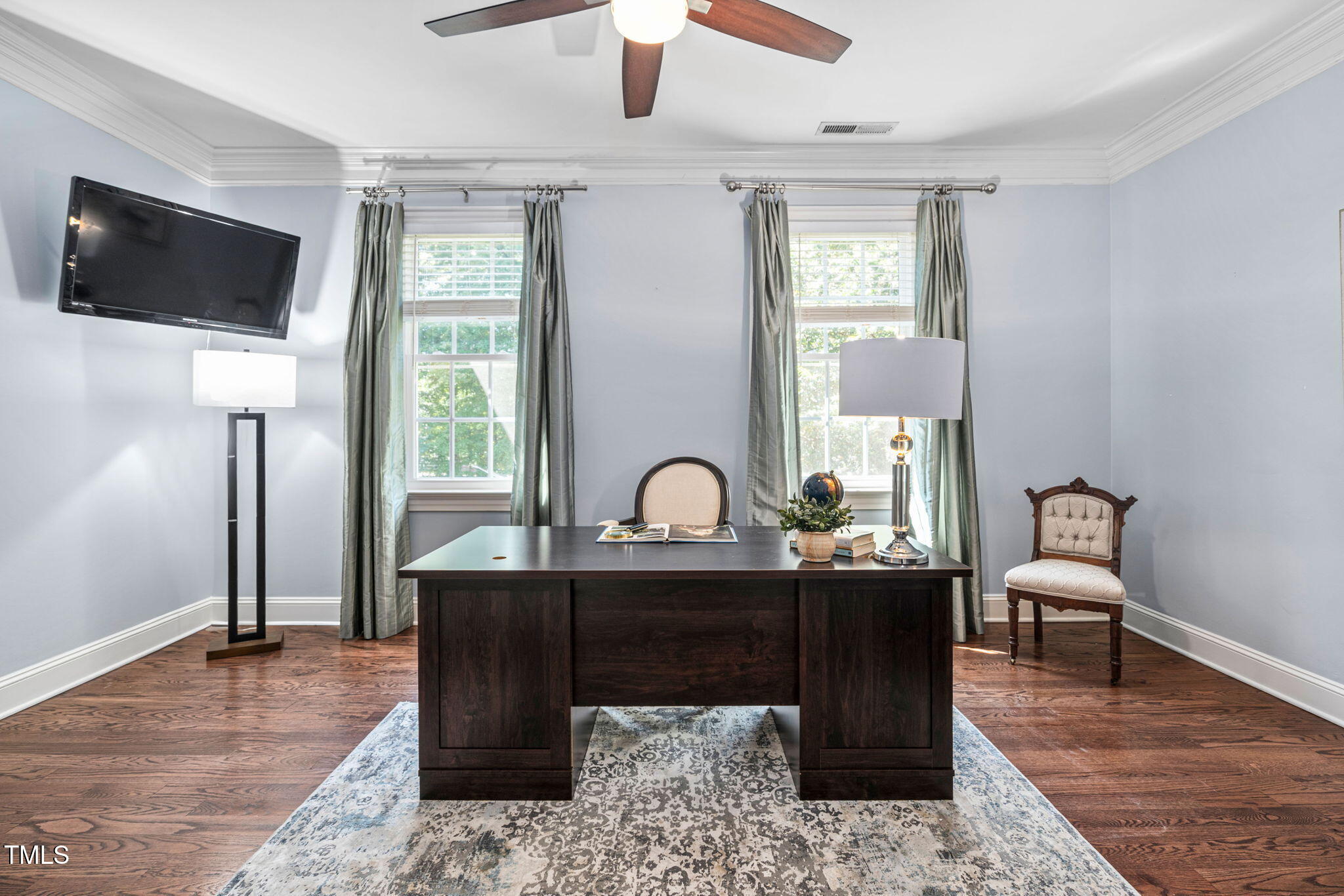 12012 Six Forks Road Raleigh, NC 27614 - Photo 45 of 100 a living room with furniture and a flat screen tv