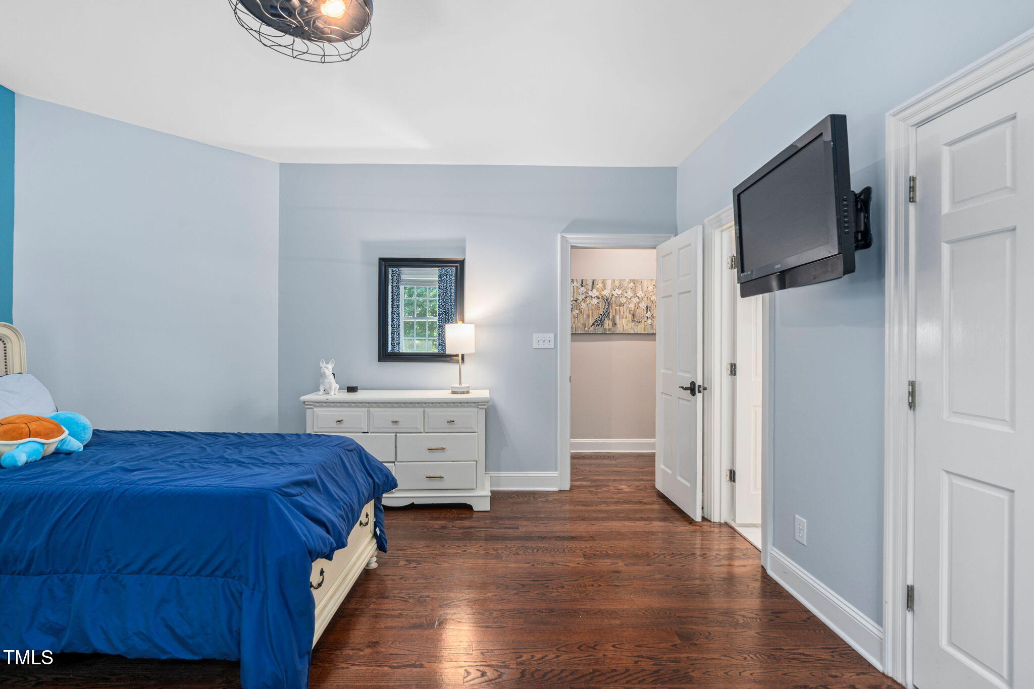 12012 Six Forks Road Raleigh, NC 27614 - Photo 48 of 100 a bedroom with a bed and a television