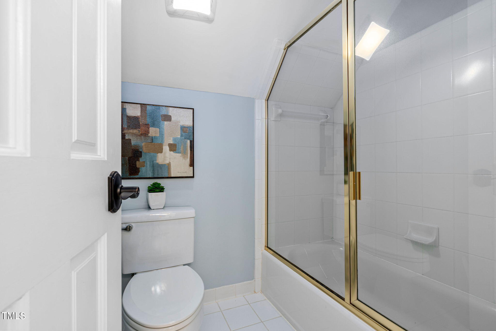 12012 Six Forks Road Raleigh, NC 27614 - Photo 50 of 100 a white toilet sitting next to a bathroom sink