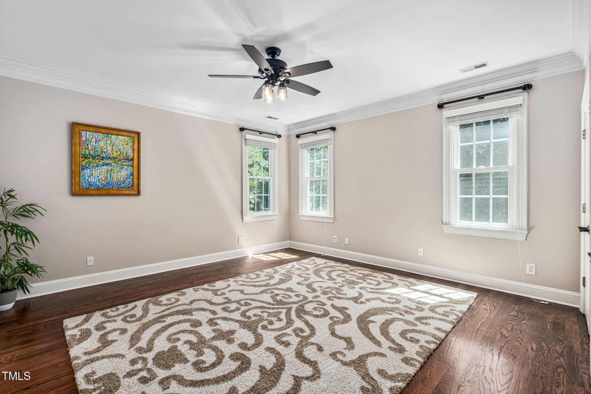 12012 Six Forks Road Raleigh, NC 27614 - Photo 56 of 100 a view of an empty room with a window and wooden floor