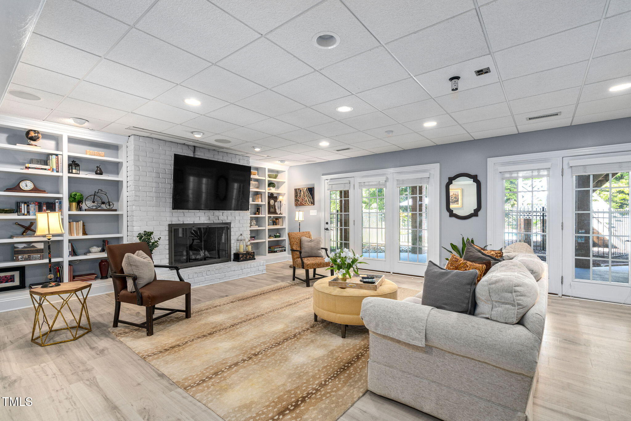 12012 Six Forks Road Raleigh, NC 27614 - Photo 62 of 100 a living room with fireplace furniture and a large window