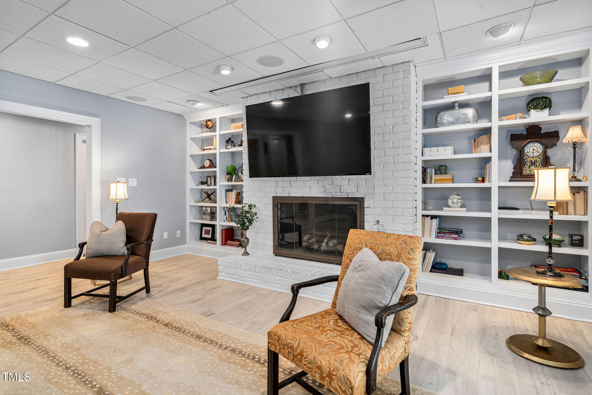 12012 Six Forks Road Raleigh, NC 27614 - Photo 65 of 100 a living room with furniture and a flat screen tv