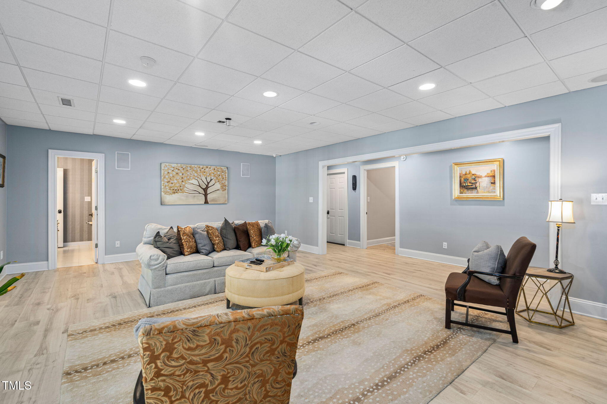 12012 Six Forks Road Raleigh, NC 27614 - Photo 67 of 100 a living room with furniture and a potted plant