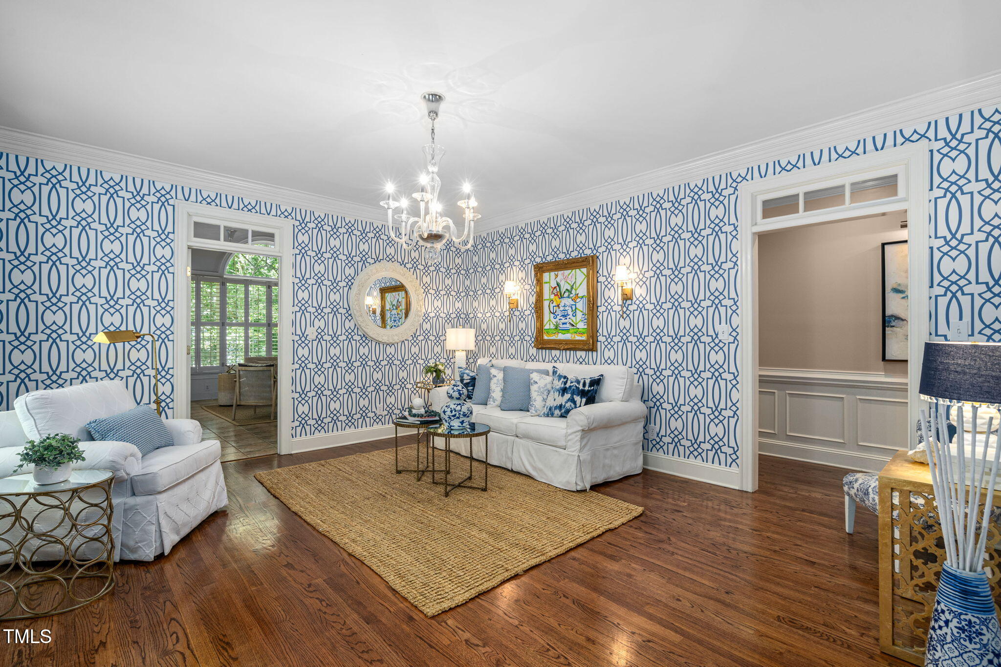 12012 Six Forks Road Raleigh, NC 27614 - Photo 7 of 100 a living room with furniture and a chandelier