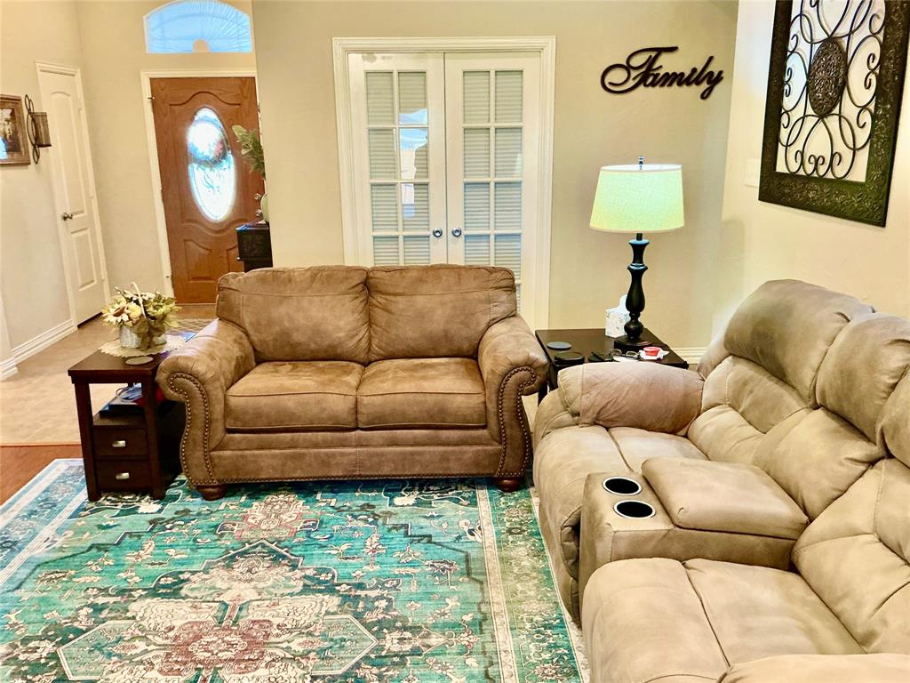 312 McAfee Street Mabank, TX 75147 - Photo 29 of 40 a living room with furniture and a large window