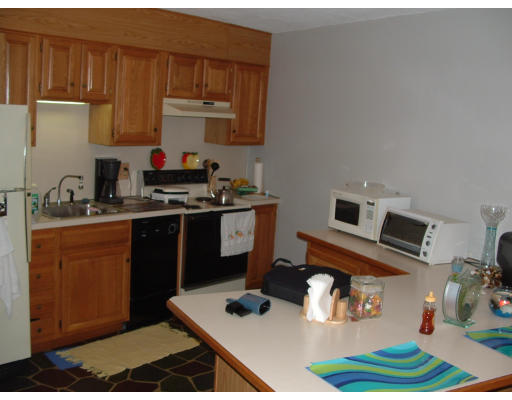 147 Turner Road, Unit 88 Holliston, MA 01746 - Photo 8 of 10 a kitchen with a stove and a refrigerator