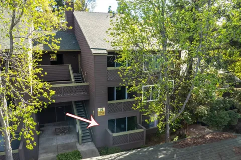 front view of a house with a tree