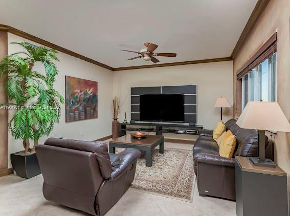 10700 Northwest 66th Street, Unit 508 Doral, FL 33178 - Photo 12 of 17 a living room with furniture and a flat screen tv