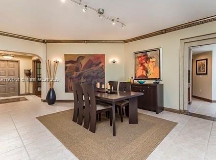 10700 Northwest 66th Street, Unit 508 Doral, FL 33178 - Photo 2 of 17 a view of a dining room with furniture