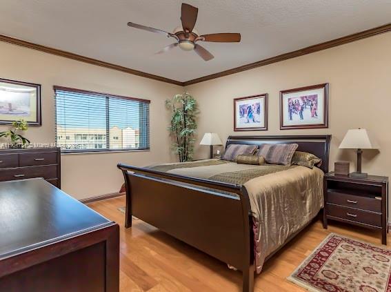 10700 Northwest 66th Street, Unit 508 Doral, FL 33178 - Photo 5 of 17 a spacious bedroom with a bed and a table in it