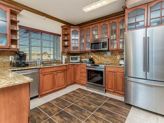 10700 Northwest 66th Street, Unit 508 Doral, FL 33178 - Photo 10 of 17 a kitchen with stainless steel appliances granite countertop a stove a sink dishwasher a refrigerator and cabinets with wooden floor