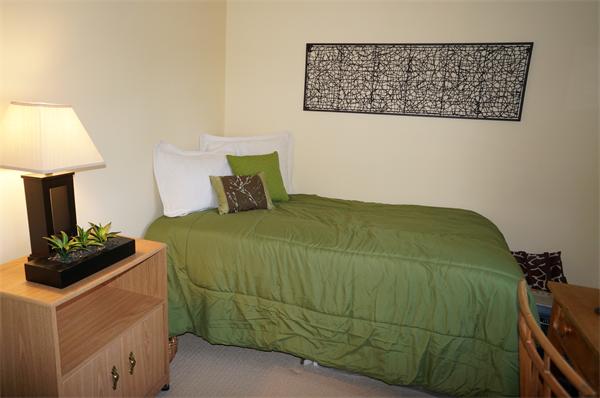 103 Taylor Road Stow, MA 01775 - Photo 7 of 15 a bedroom with a bed and a lamp