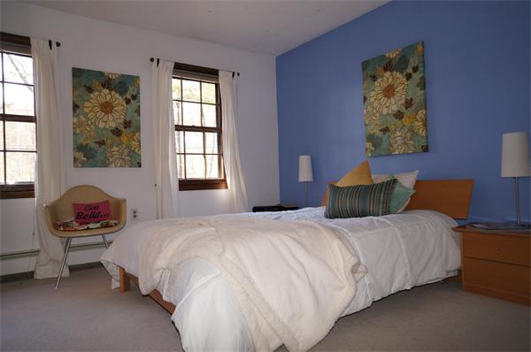103 Taylor Road Stow, MA 01775 - Photo 8 of 15 a bedroom with a bed and wooden floor