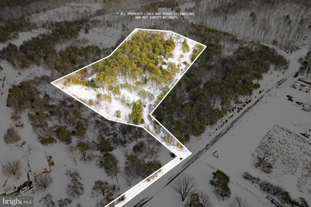 a view of lake with houses in the background