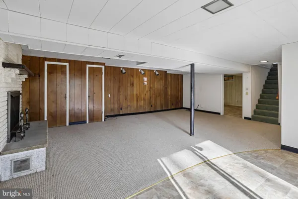a view of an empty room with stairs
