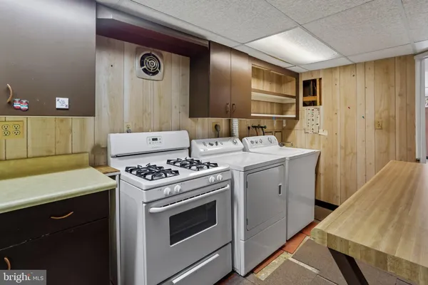 a kitchen with a stove and a sink