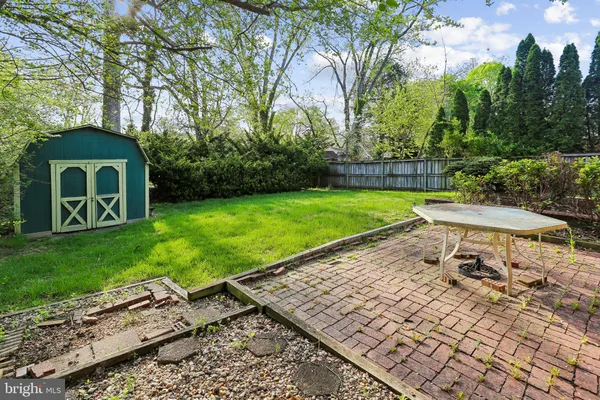 a view of a backyard with sitting area