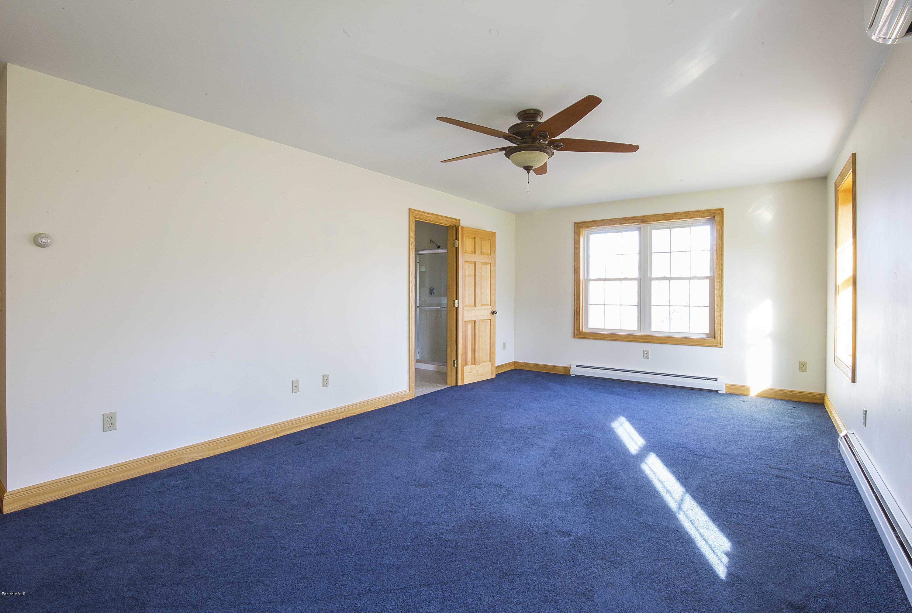 297 Cummington Road Ashfield, MA 01330 - Photo 8 of 27 an empty room with windows and closet