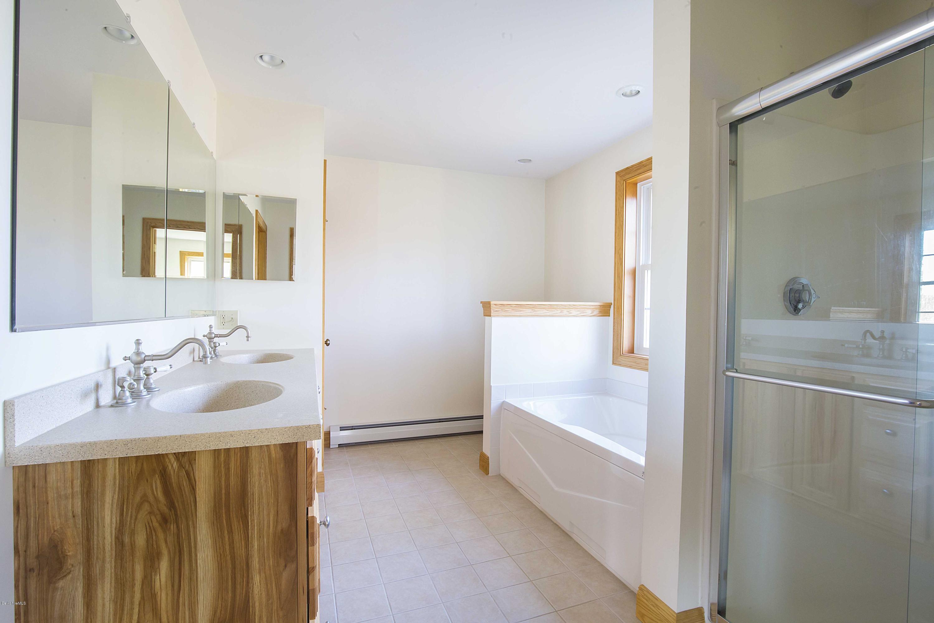 297 Cummington Road Ashfield, MA 01330 - Photo 10 of 27 a bathroom with a sink and a mirror