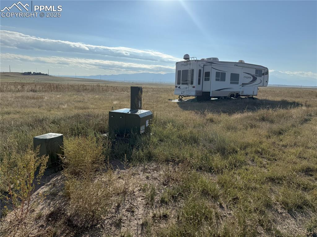 12325 Prairie Sun Point Colorado Springs, CO 80929 - Photo 5 of 15 a view of a house with a yard and sitting area