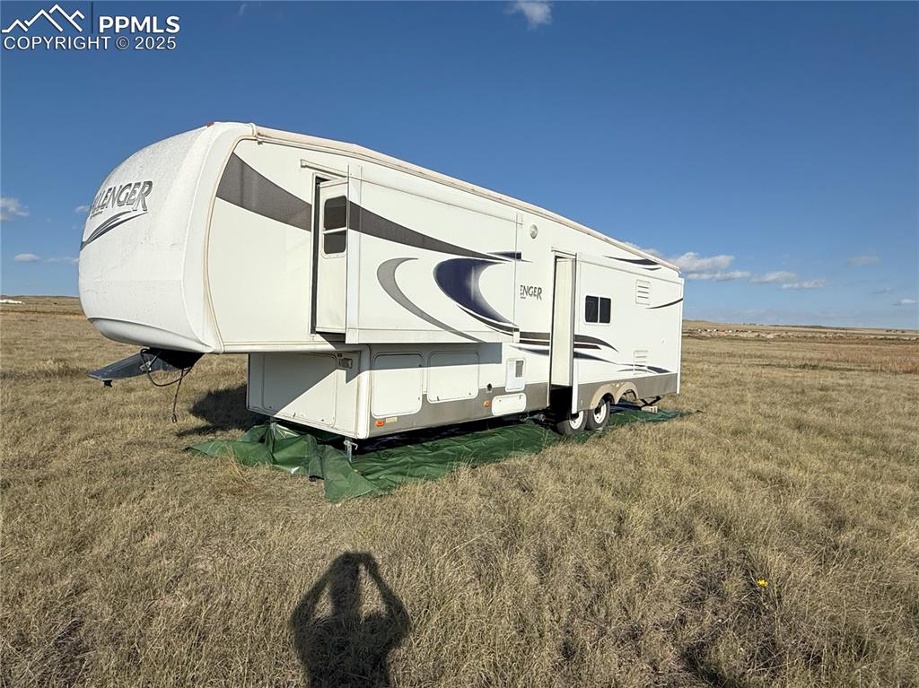 12325 Prairie Sun Point Colorado Springs, CO 80929 - Photo 8 of 15 a view of a room with table and chairs