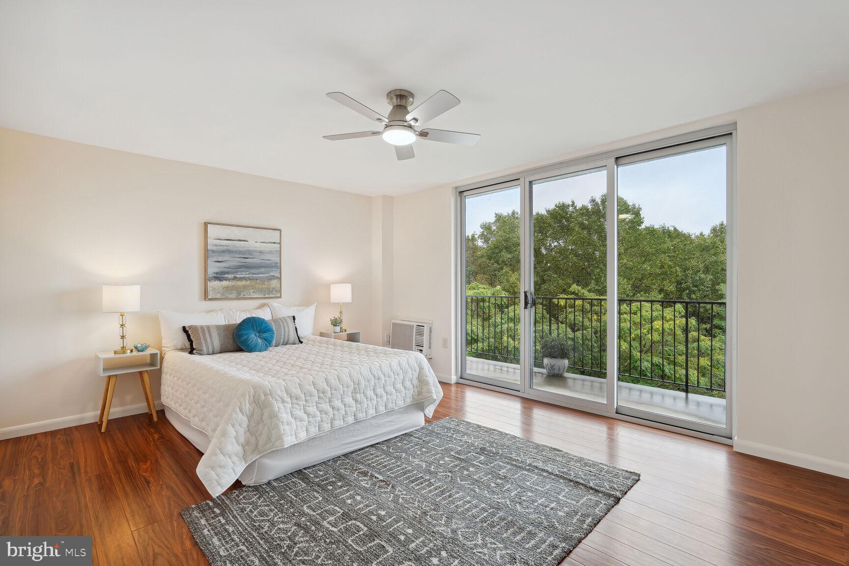 3245 Rio Drive, Unit 915 Falls Church, VA 22041 - Photo 11 of 31 a living room with a bed furniture and a large window