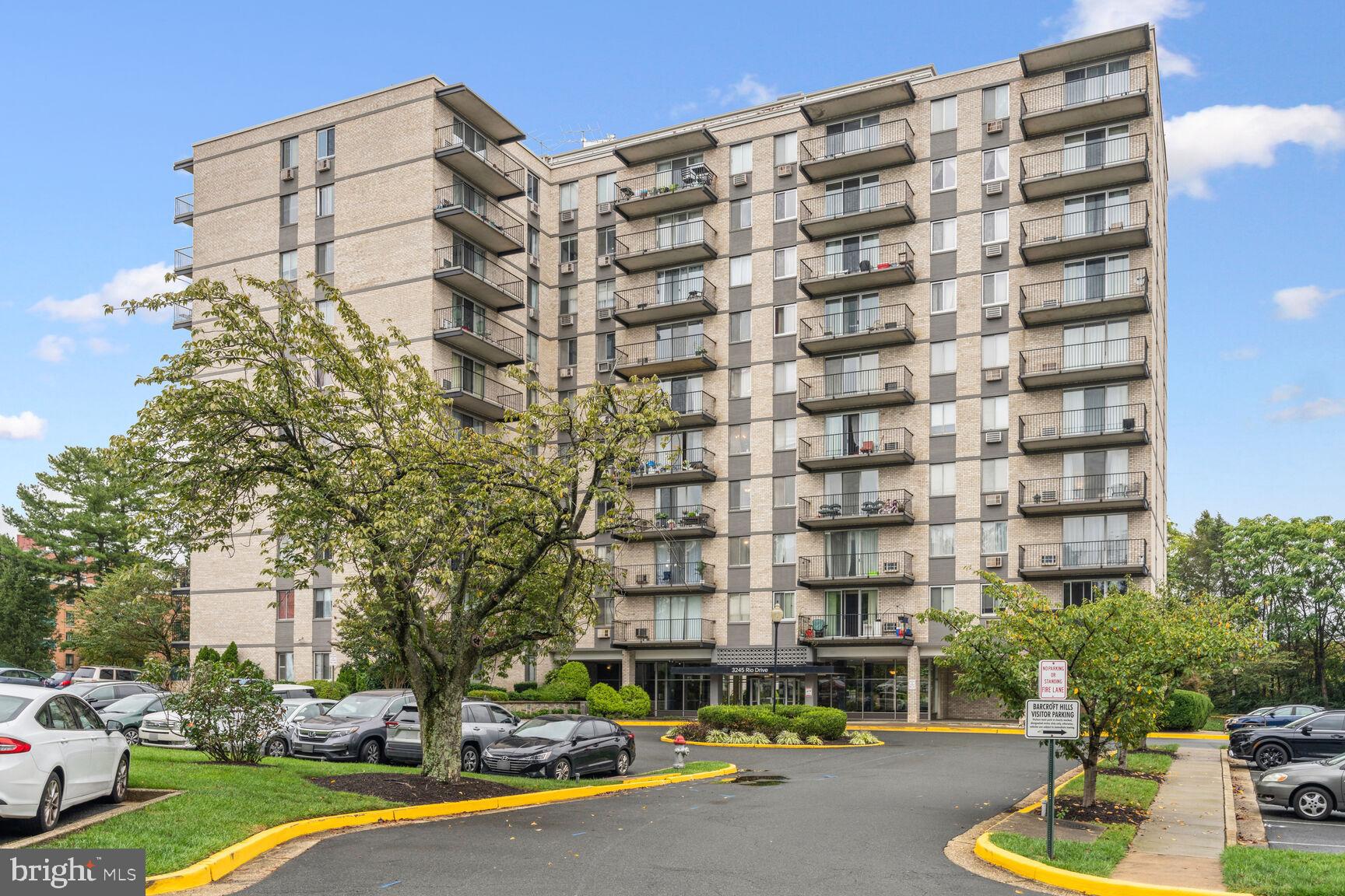 3245 Rio Drive, Unit 915 Falls Church, VA 22041 - Photo 2 of 31 a building view with swimming pool and glass windows