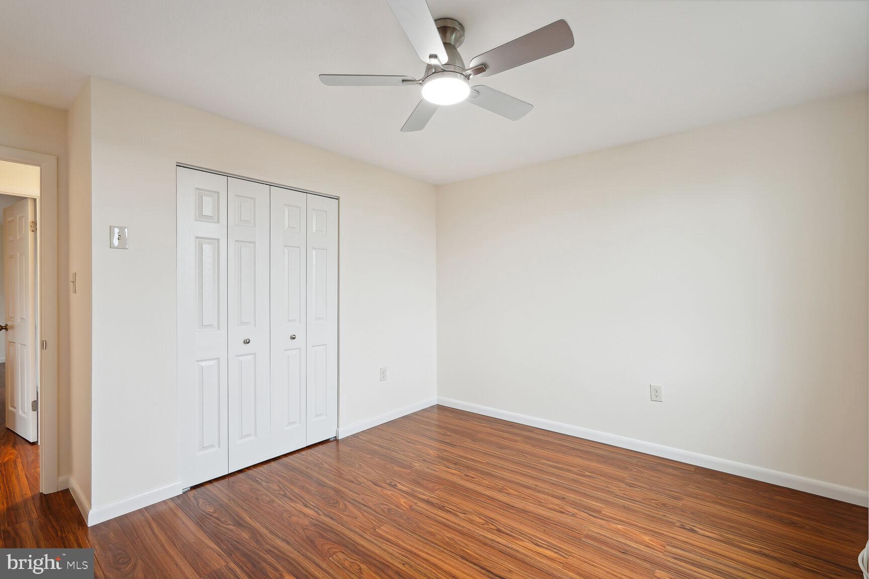 3245 Rio Drive, Unit 915 Falls Church, VA 22041 - Photo 21 of 31 a view of an empty room with wooden floor