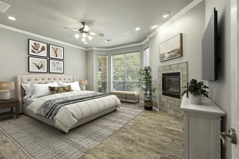 a spacious bedroom with a large bed and a chandelier