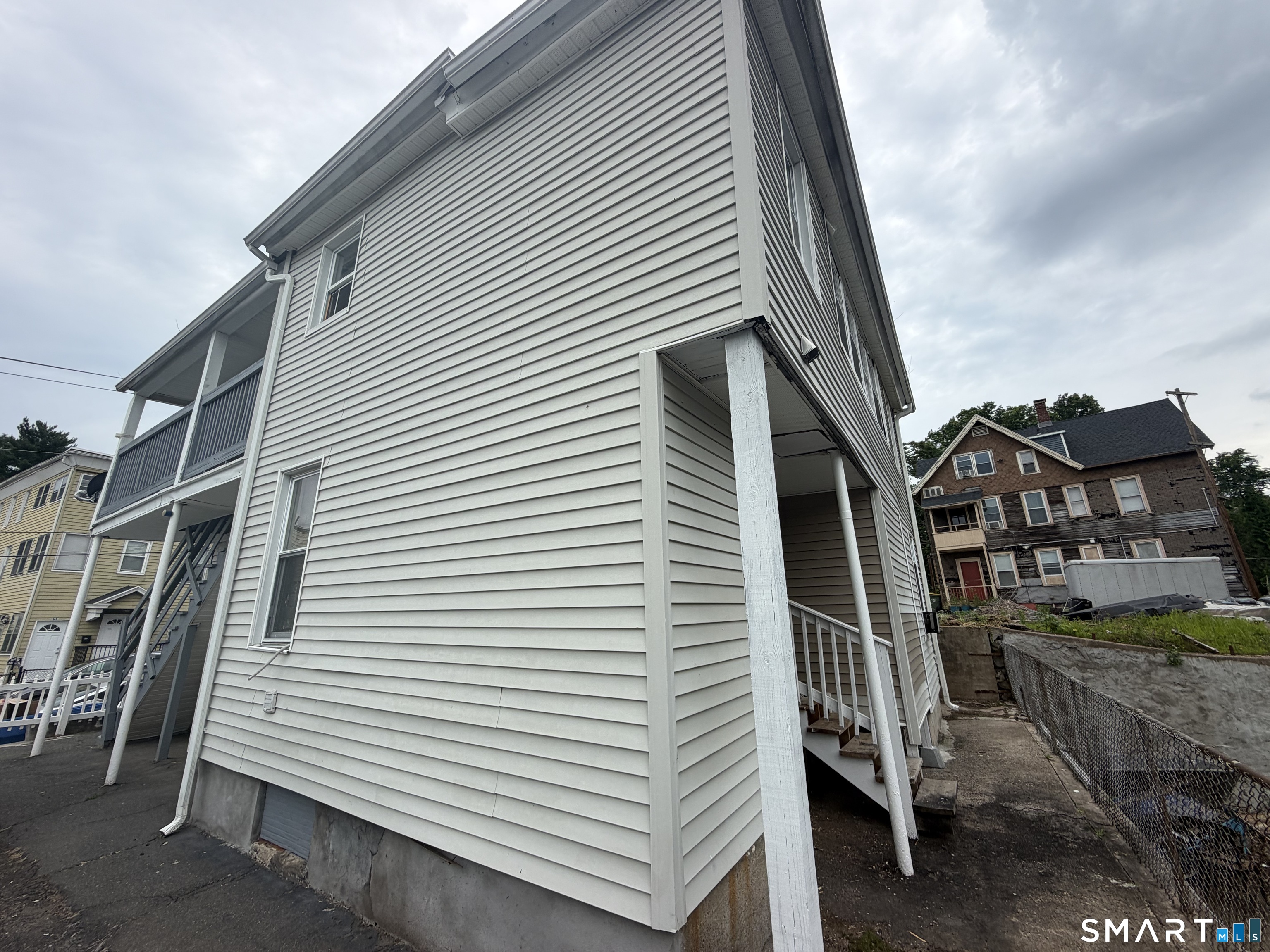 62 North Leonard Street Waterbury, CT 06708 - Photo 2 of 13 a view of a house with a deck