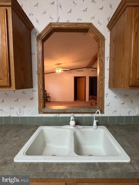 16 Doe Drive Elkton, MD 21921 - Photo 11 of 32 a kitchen with a sink and a mirror