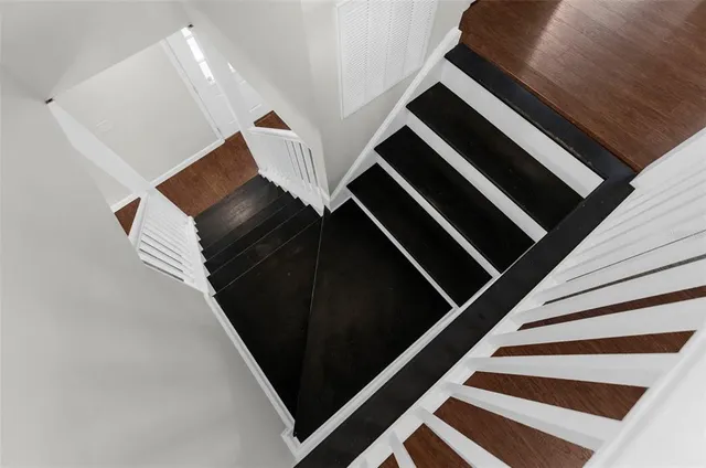 a view of a hallway with a white walls