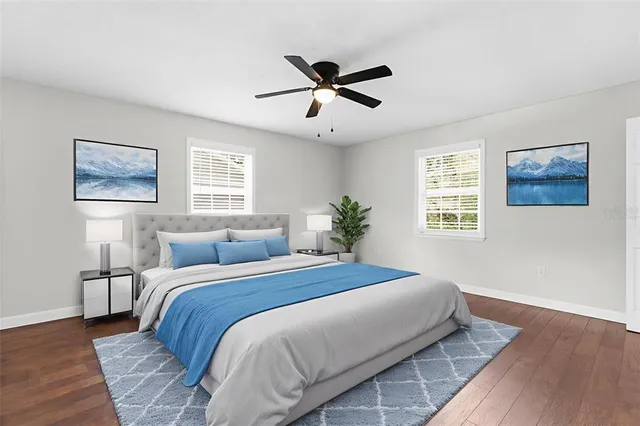 a living room with furniture kitchen view and a flat screen tv
